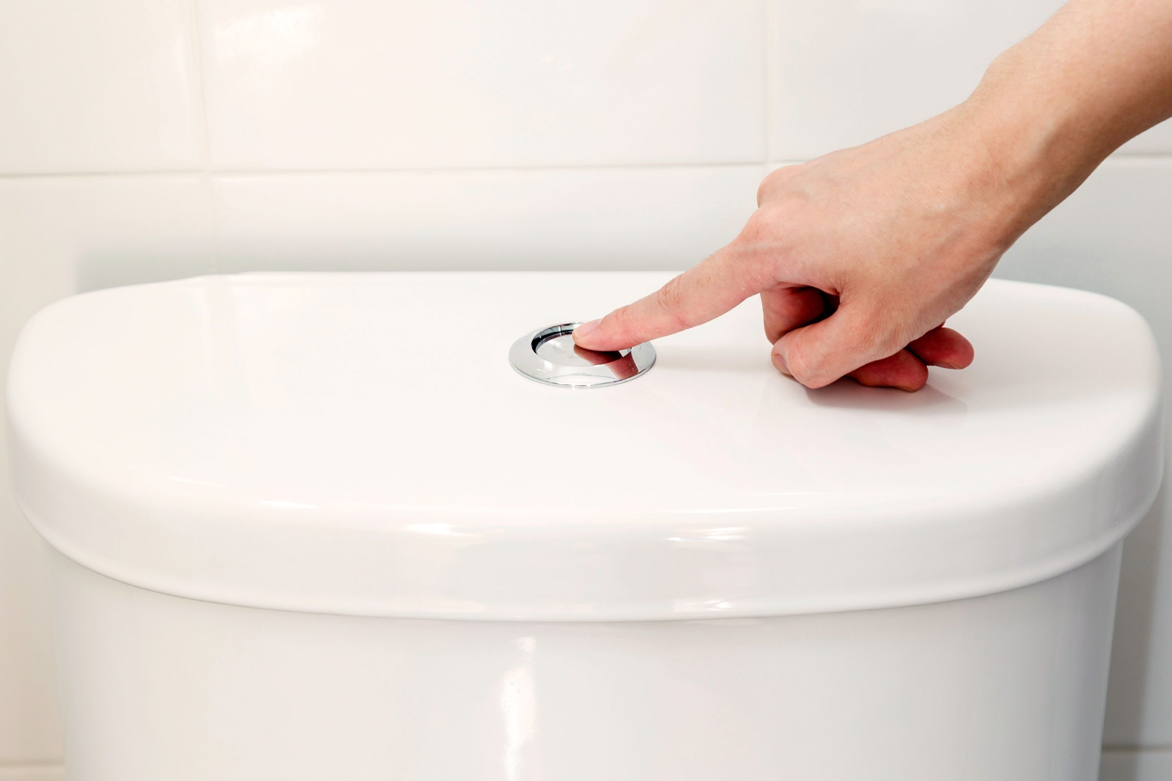 person flushing toilet