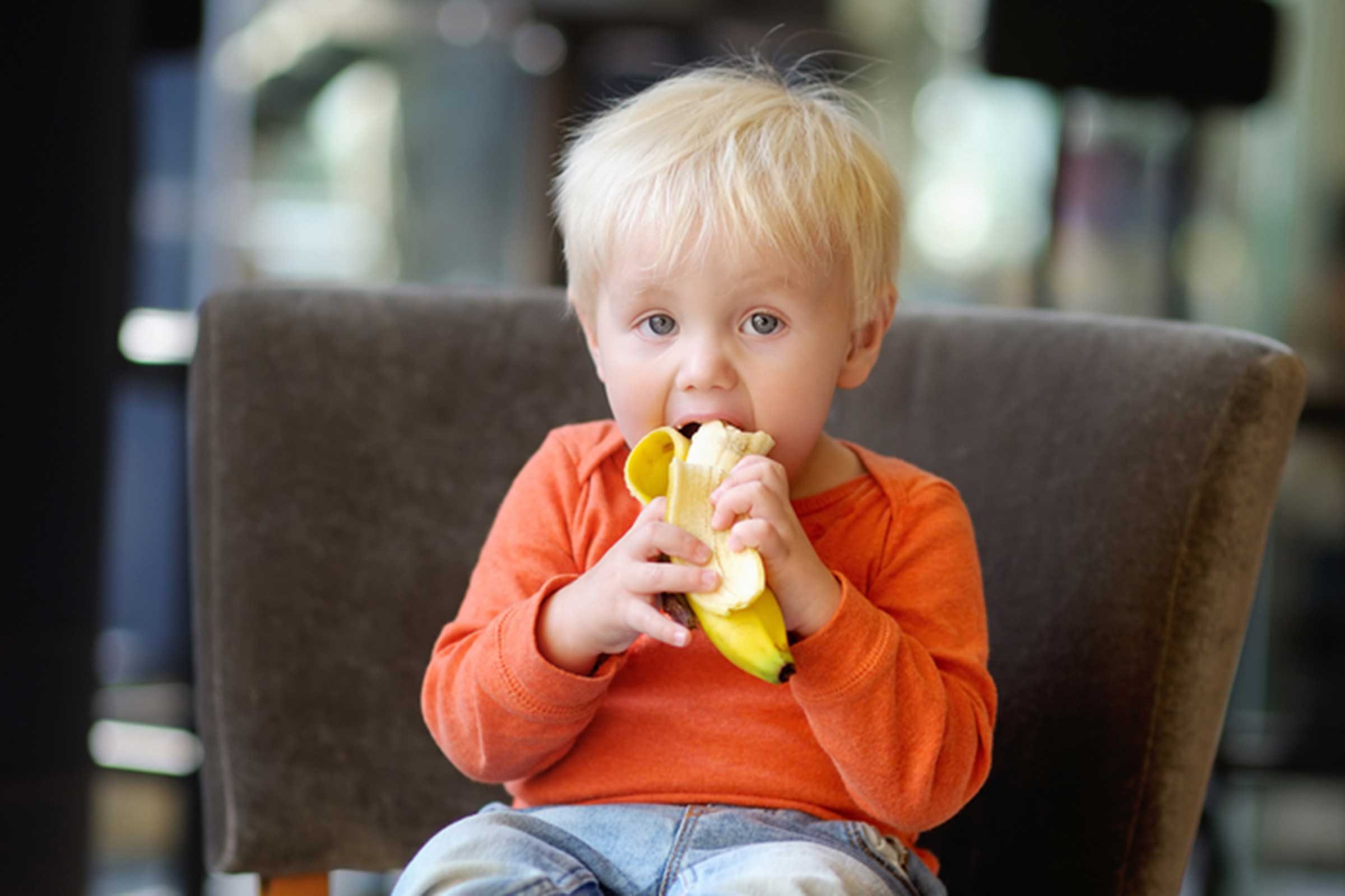 toddler eating a banana