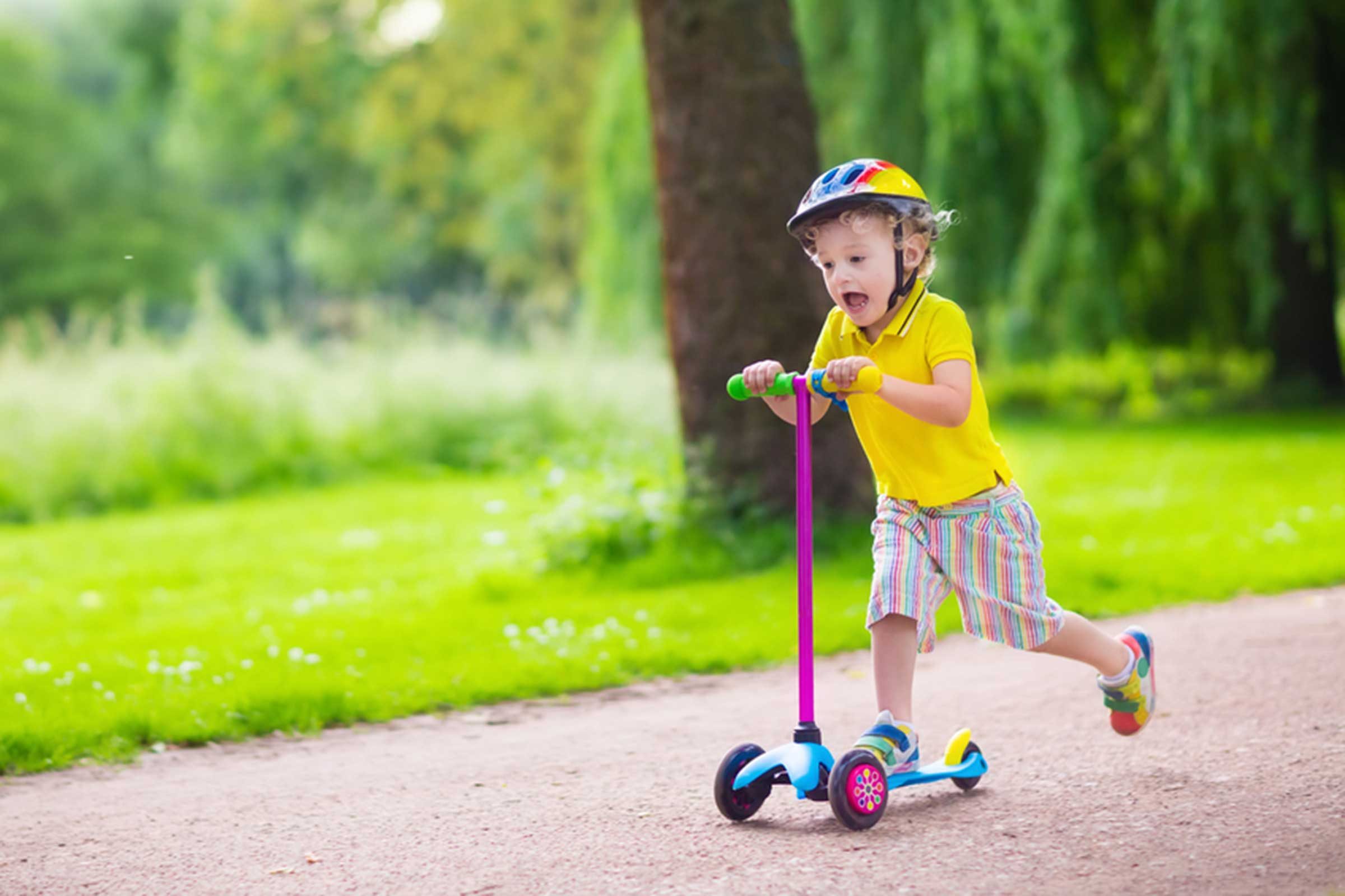 kid riding a scooter