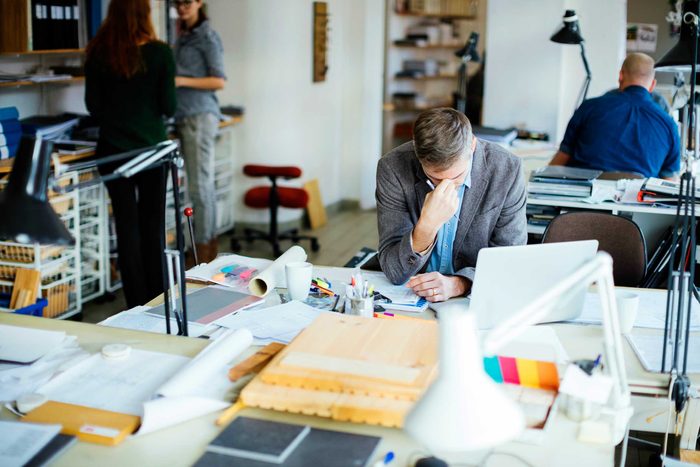 Man looking stressed out at work