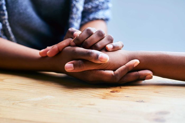 Close-up of hands holding another hand