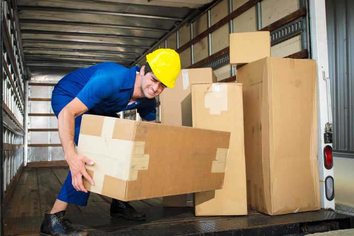 man lifting big box