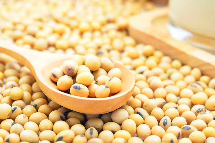 dried soy beans with a wooden spoonful