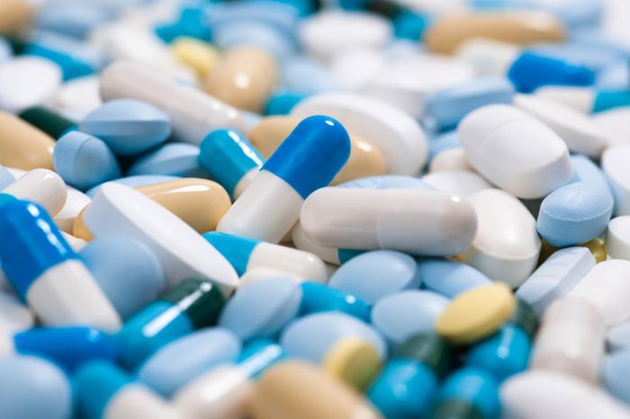 Pile of medications: tablets, pills and capsules.
