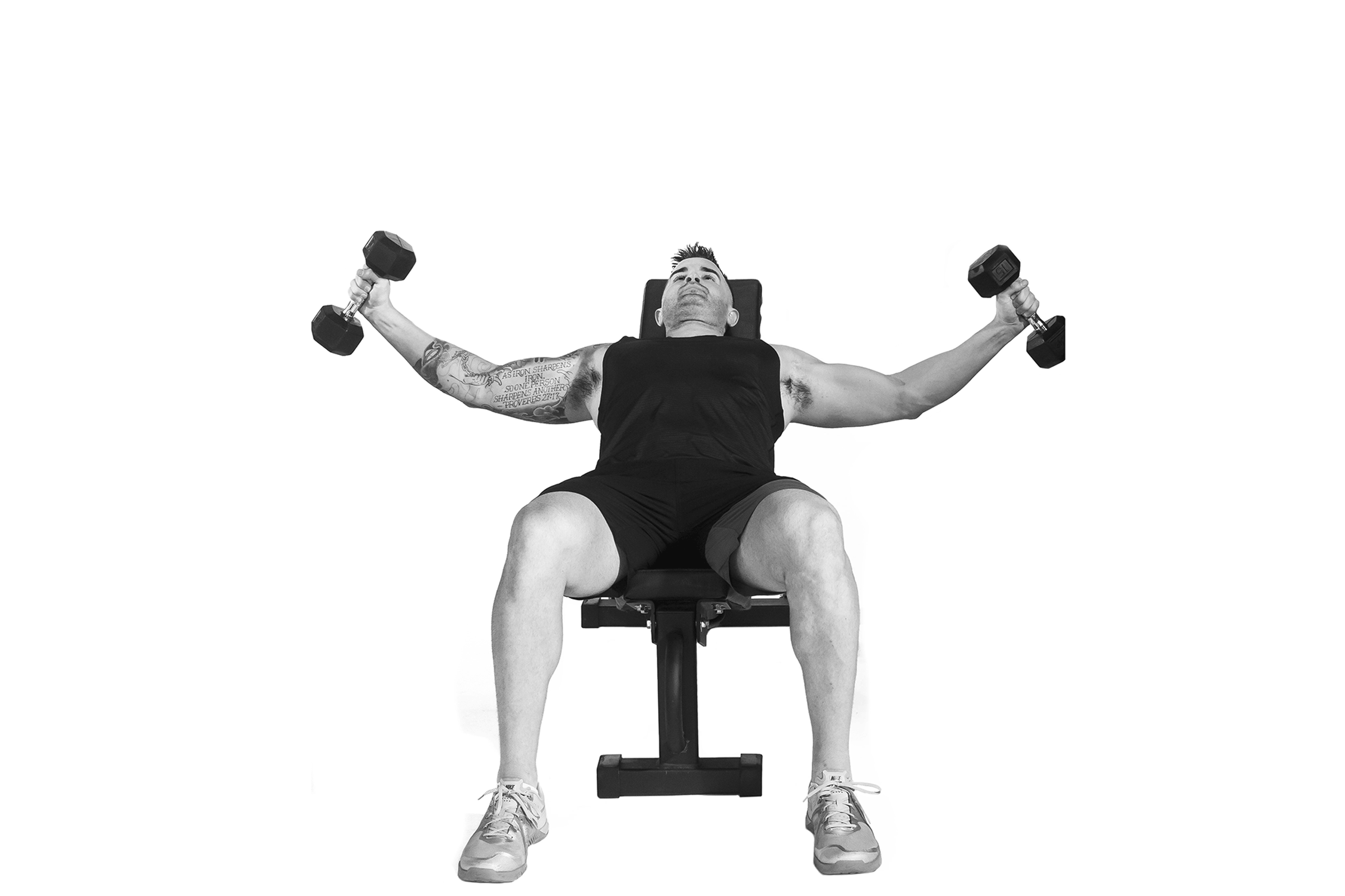 Man doing incline dumbbell chest fly.