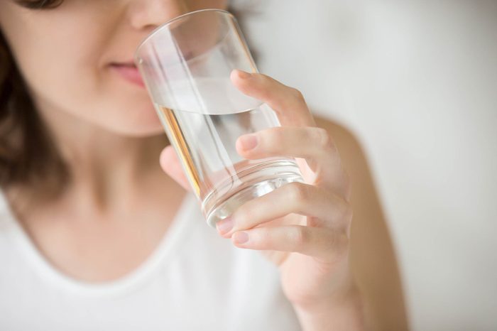 Woman drinking glass of water