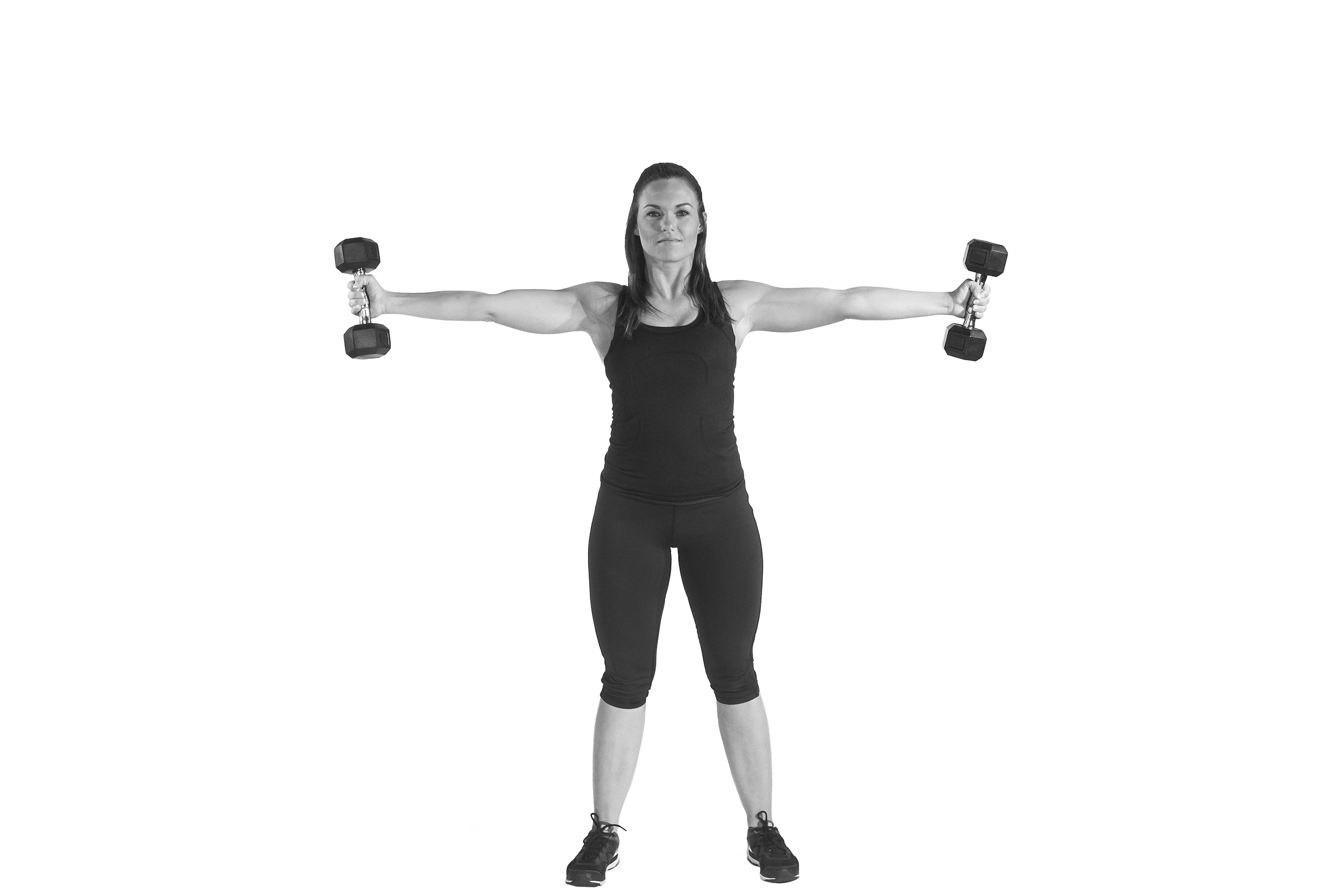 Woman doing dumbbell iron cross.