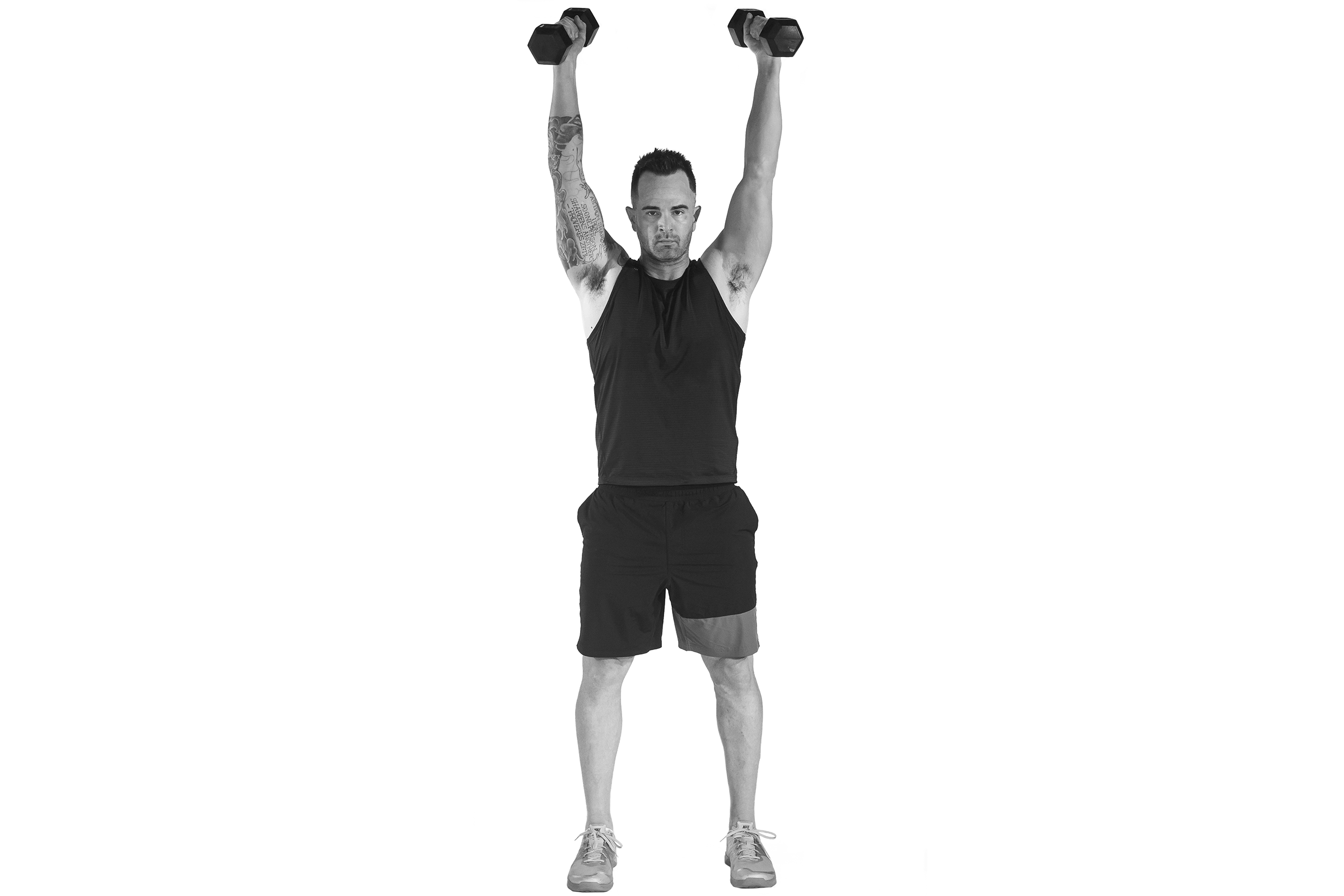 Man doing power dumbbell front raise.