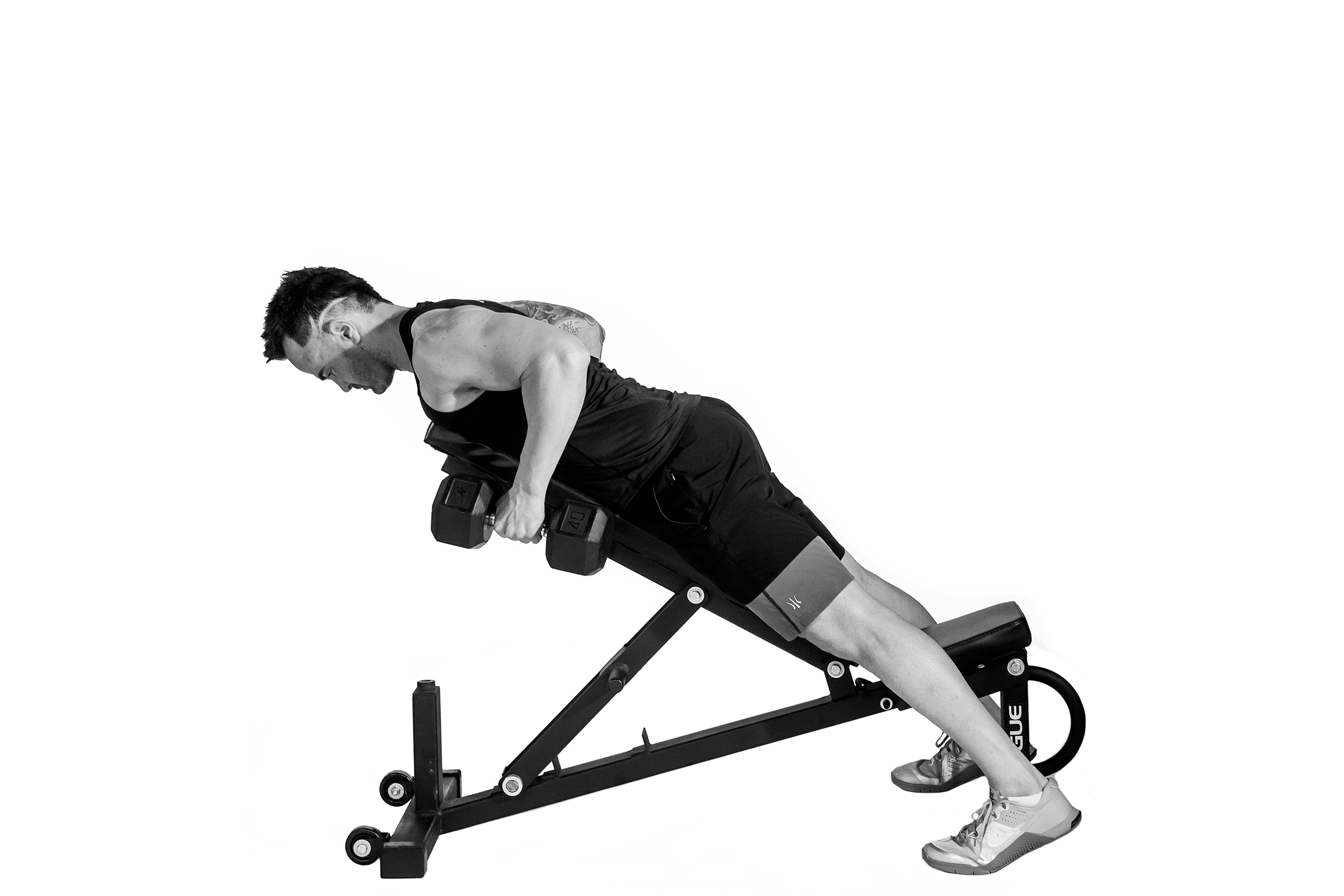 Man doing chest-supported dumbbell rows.
