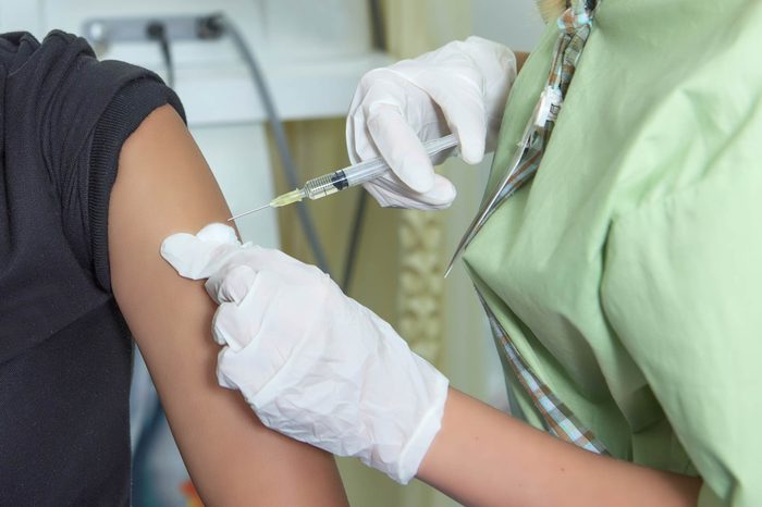 nurse giving a patient the flu shot
