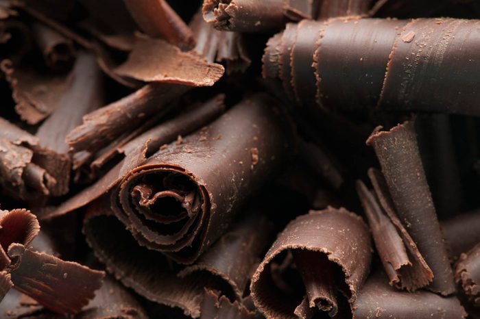 thinly shaved pieces of dark chocolate