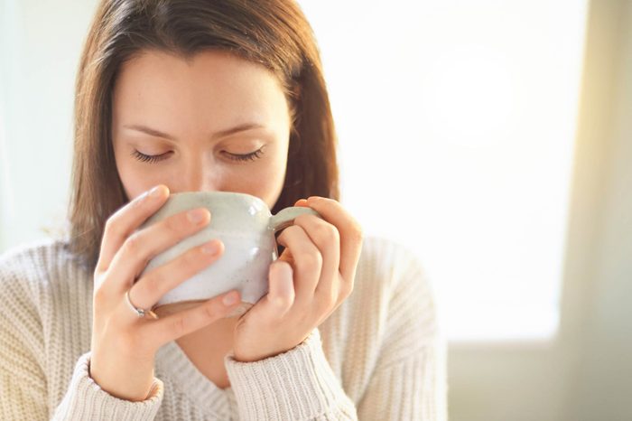 woman sipping a cup of tea