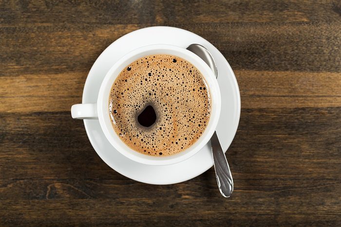 cup and saucer of black coffee