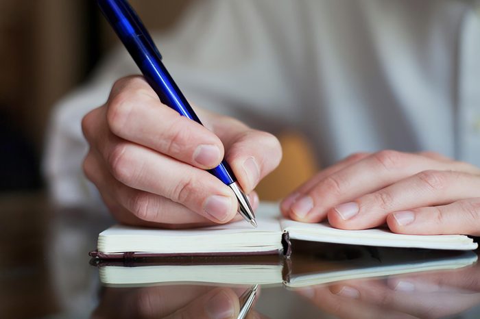 woman writing in journal