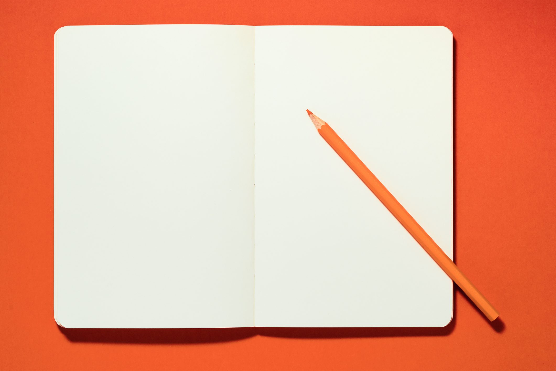 open journal on orange background