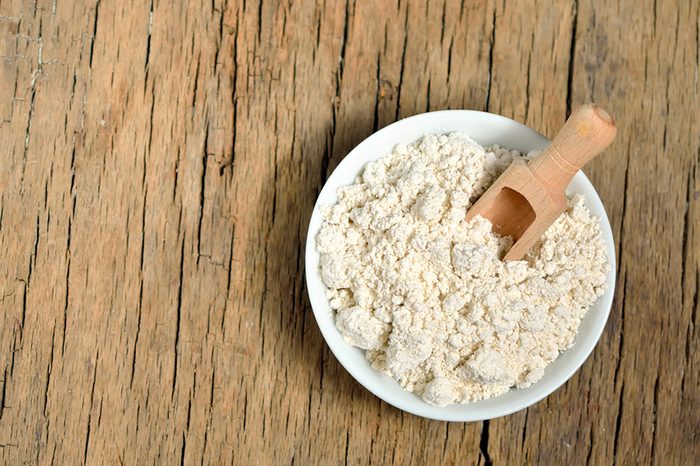 Bowl of oatmeal on a wooden table.