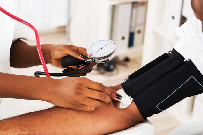 anonymous patient getting blood pressure checked at the annual check up appointment