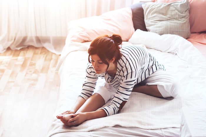 Woman doings stretches.