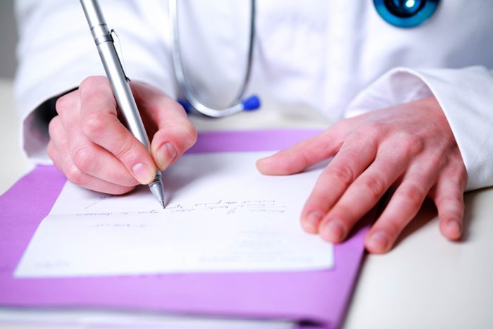 doctor writing Rx