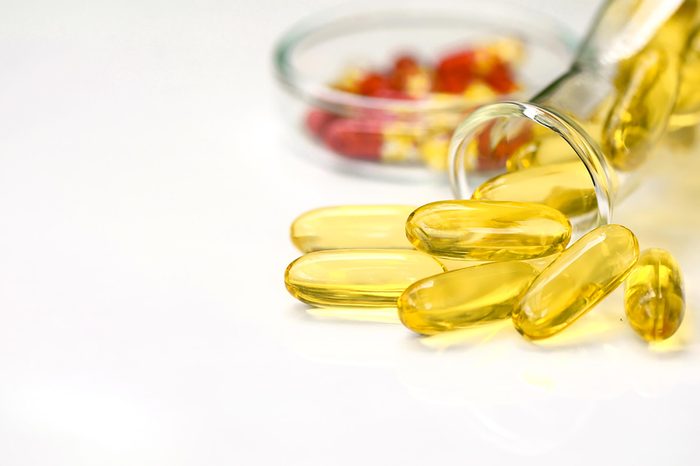 close up of translucent yellow vitamin capsules