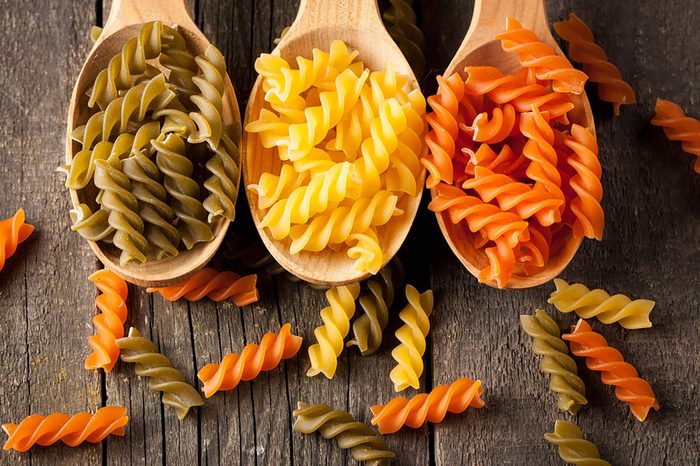 Three spoons of pasta noodles.