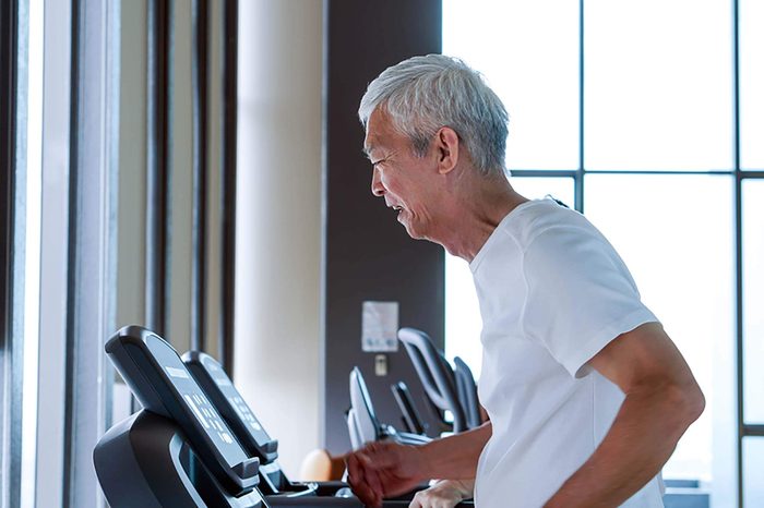 Man running on a treadmill.