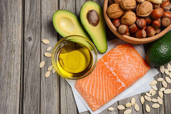 Salmon, olive oil, avocado, nuts, and pumpkin seeds.