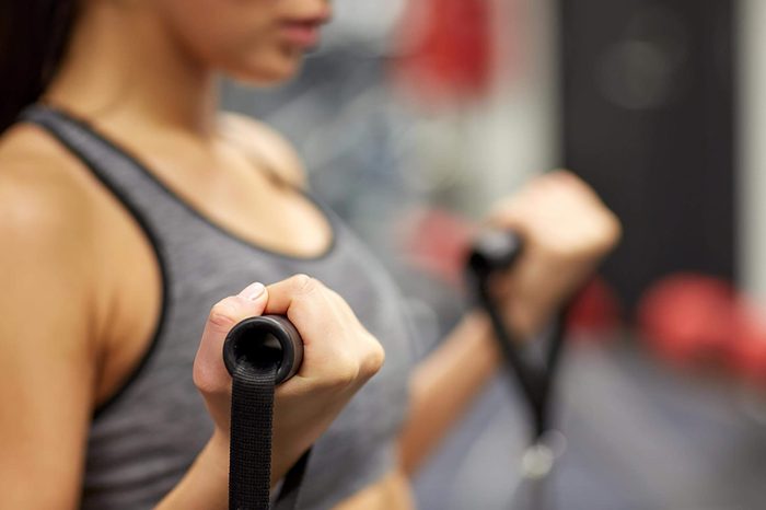 woman holding resistance band straps