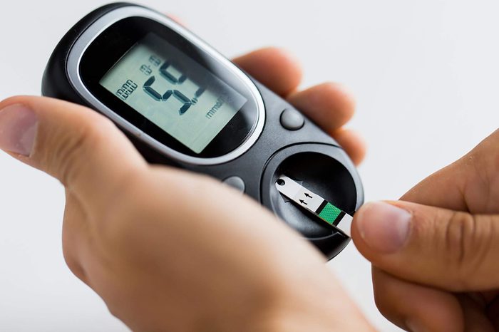 Man testing his blood sugar