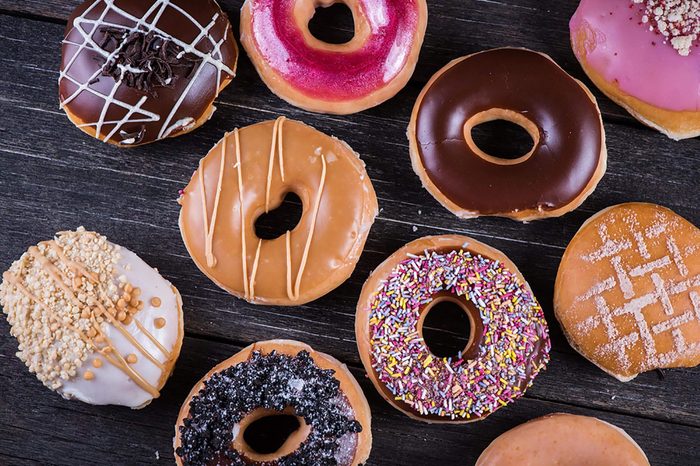 Assortment of glazed doughnuts with different toppings