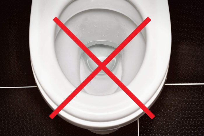 Toilet bowl with an X through it.