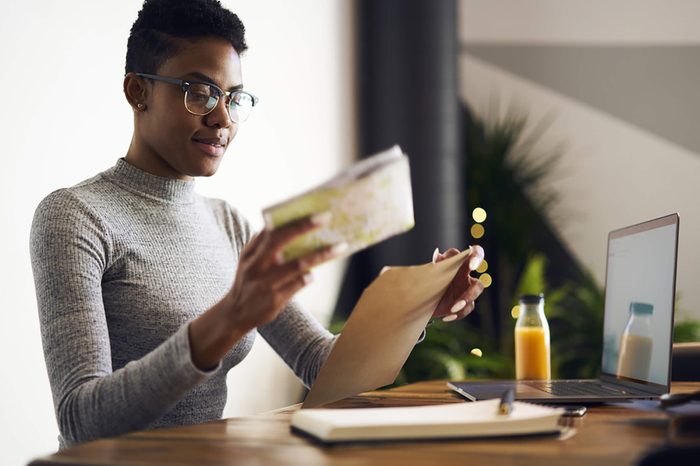black woman checking her mail