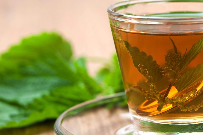 glass mug of nettle tea