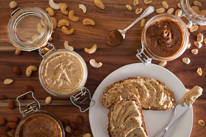 Grainy bread topped with nut butter.