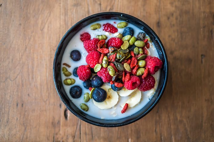 Overnight oats topped with fruit and seeds.
