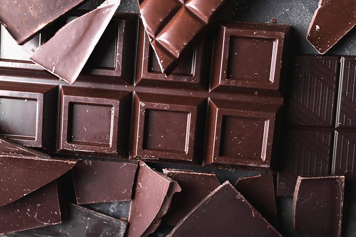 Coffee beans with chocolate and dark chocolate . Broken slices of chocolate. Chocolate bar pieces. Coffee beans.