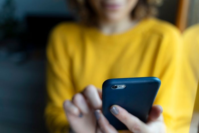 close up of smartphone in woman's hands