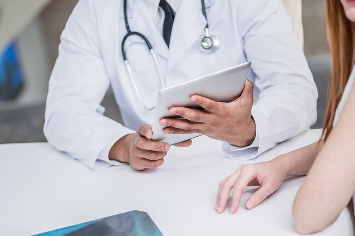 Doctor discussing medical options with a patient.
