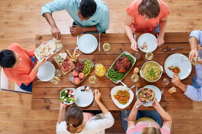 Group of people having dinner at table 