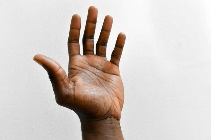 man's hand against white background