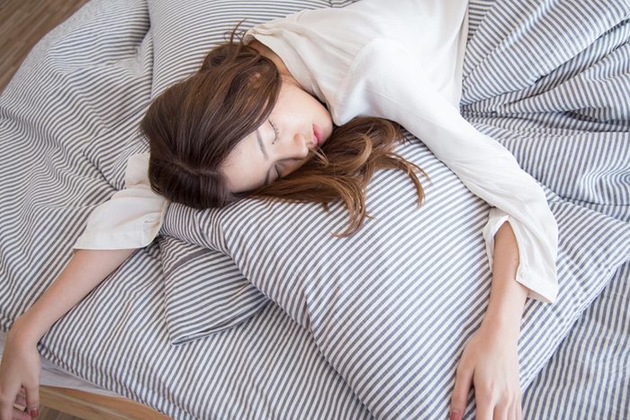 tired woman in bed