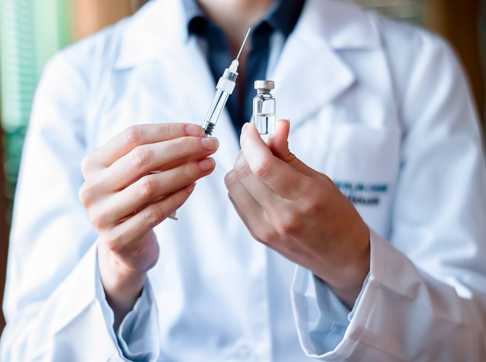 Syringe and ampule, bottle, medical injection in hand, palm or fingers. Medicine plastic vaccination equipment with needle. Nurse or doctor. Liquid drug or narcotic. Health care in hospital.