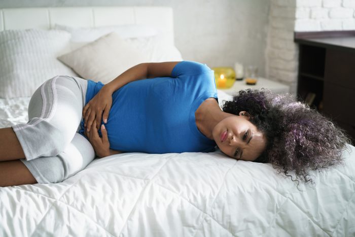 Sad young woman with menstrual pain