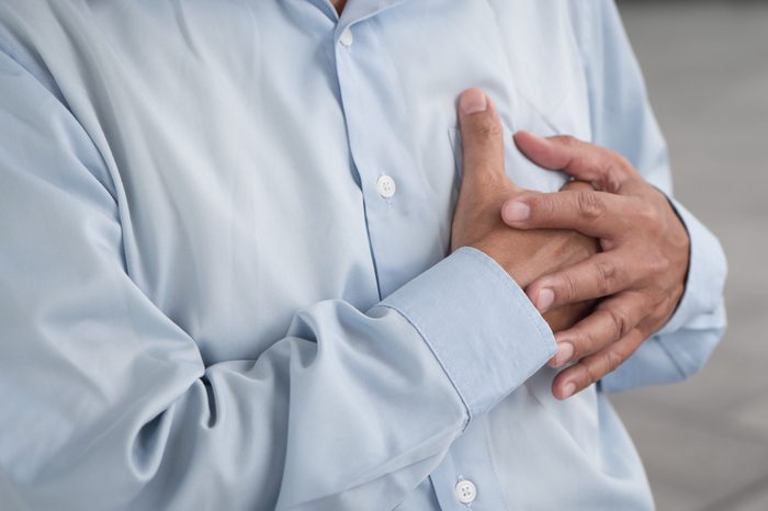 senior man heart attack, hand holding chest