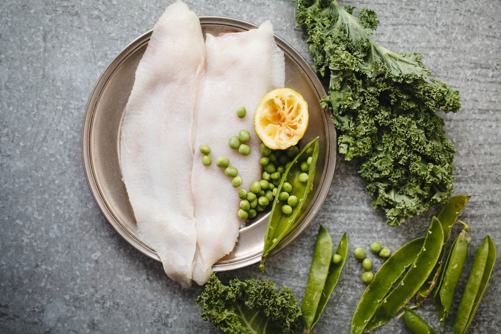 Megrim fish fillet raw fish meat with green vegetables quinoa Clean eating, dieting vegetarian raw food