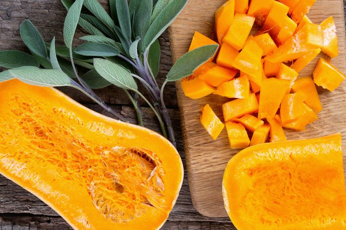 butternut squash over old wood background