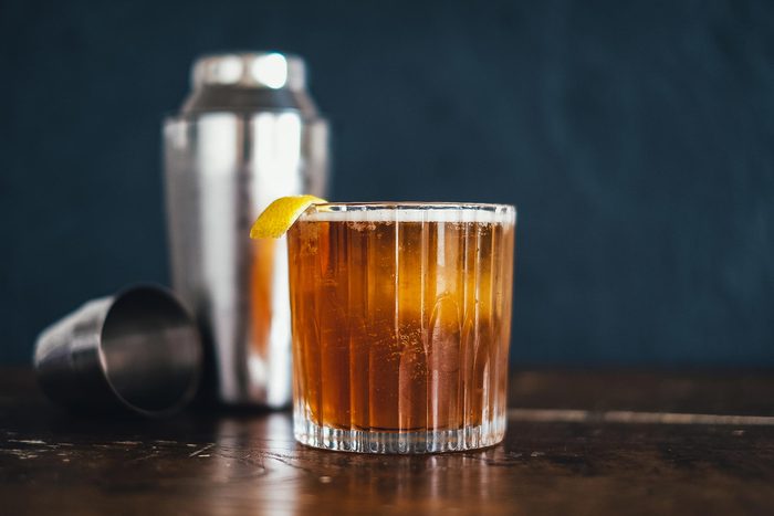 drink in a tumbler with a lemon twist