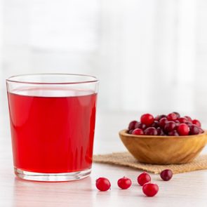 Glass with fresh organic cranberry juice.