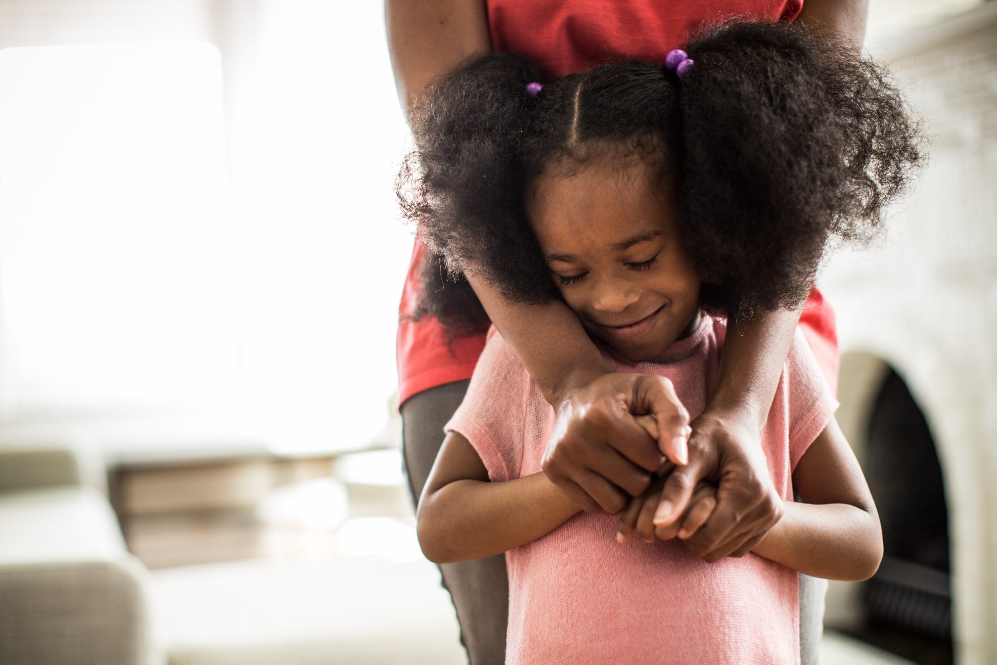 mother's arms embracing daughter