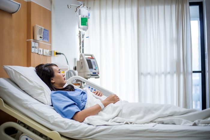 Patient looking at the window with hope in the hospital